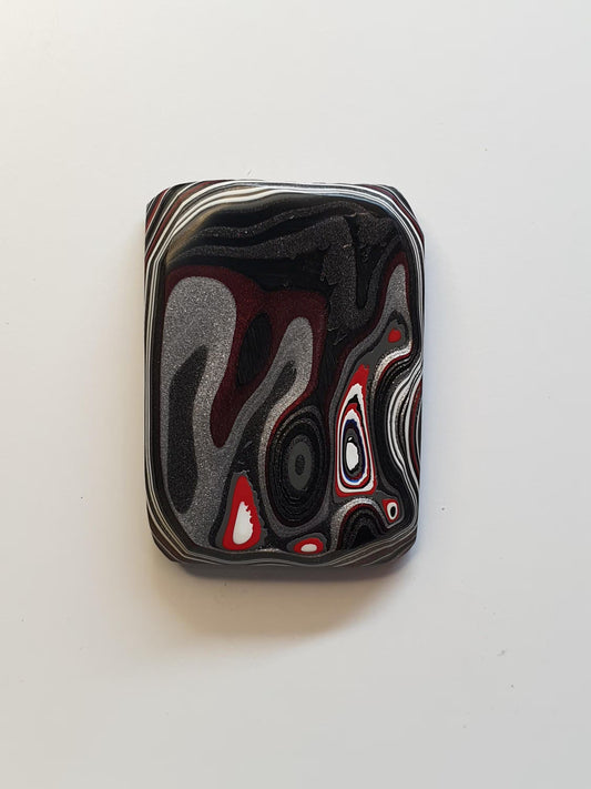 Fordite cabochon